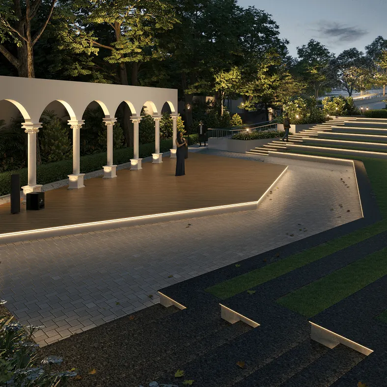 An amphitheatre with arched pavilions under the evening lights